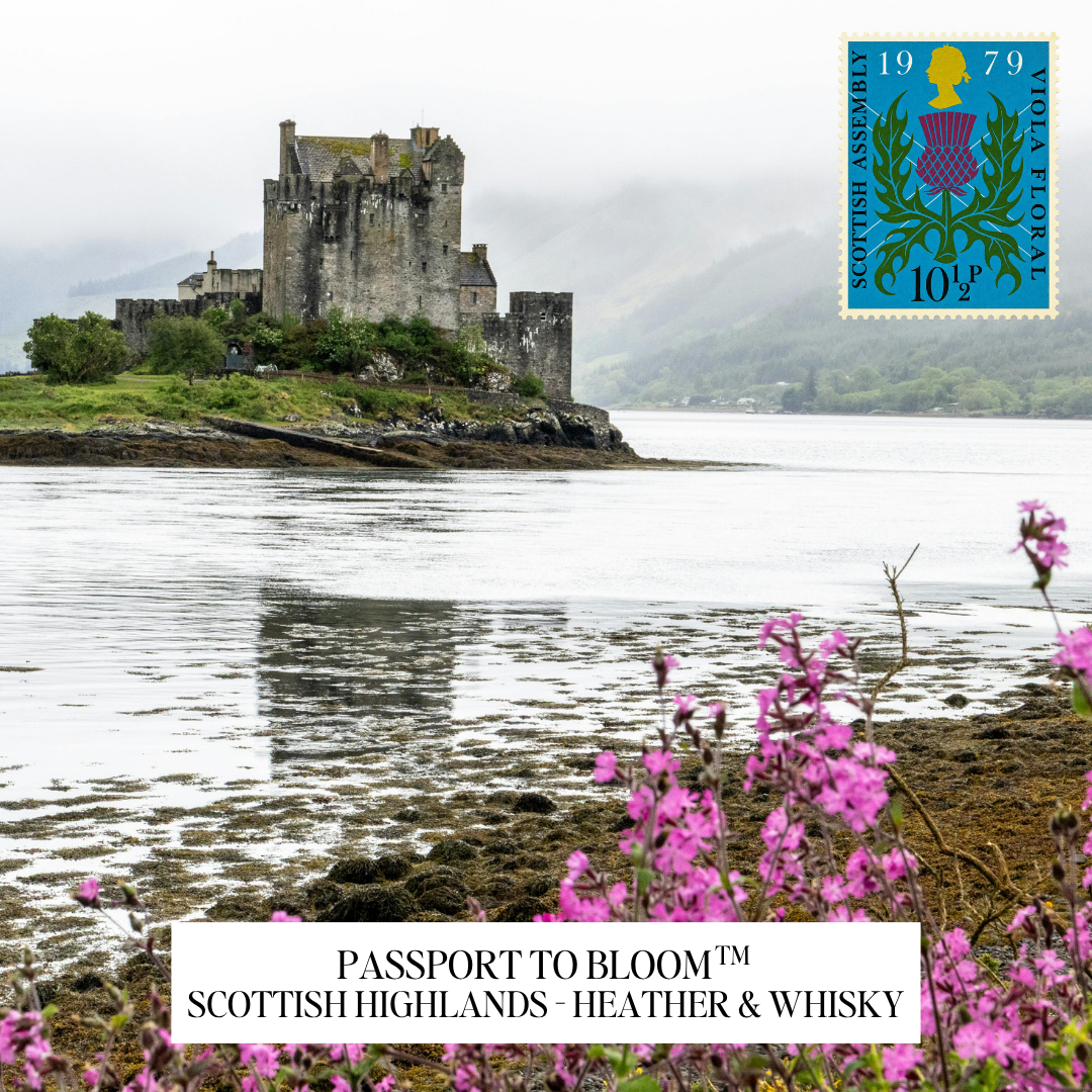 A scenic photograph of a stone castle on a small island by the water, with misty mountains in the background and pink flowers in the foreground. A postage stamp design appears in the top right corner, and a white label at the bottom reads 'PASSPORT TO BLOOM ™ SCOTTISH HIGHLANDS - HEATHER & WHISKY'.
