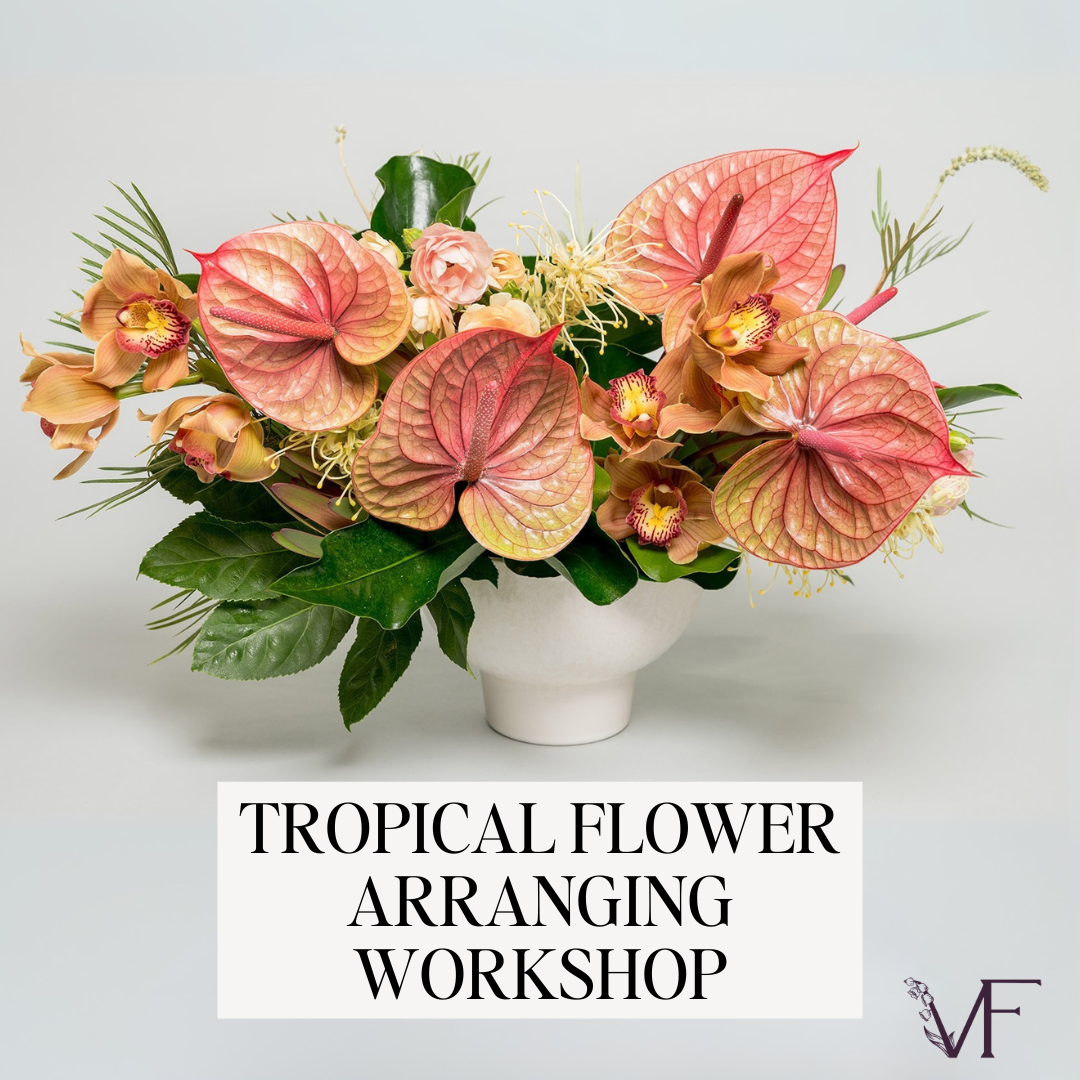 Tropical flower arrangement with pink and green leaves on a white background, featuring text for a workshop.